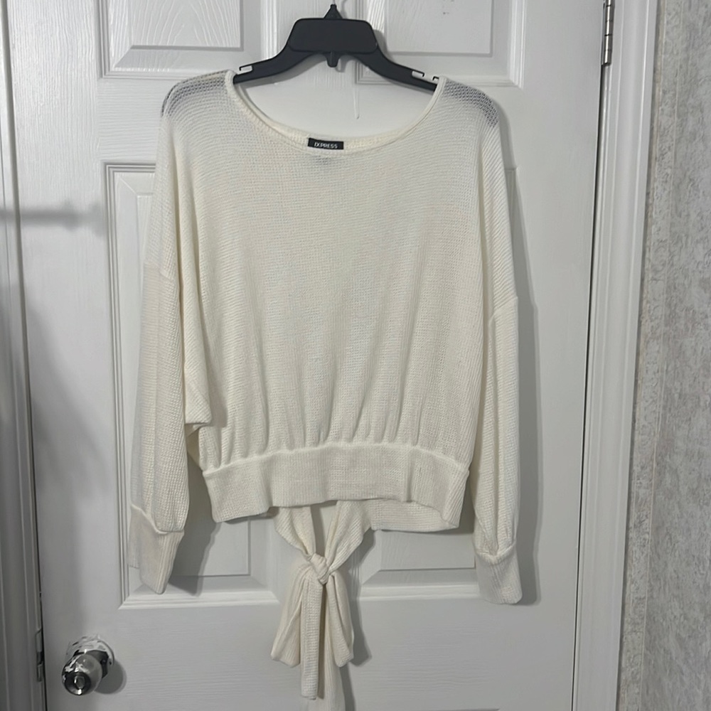 Cream essential top!! Made out of a thin thermal material
